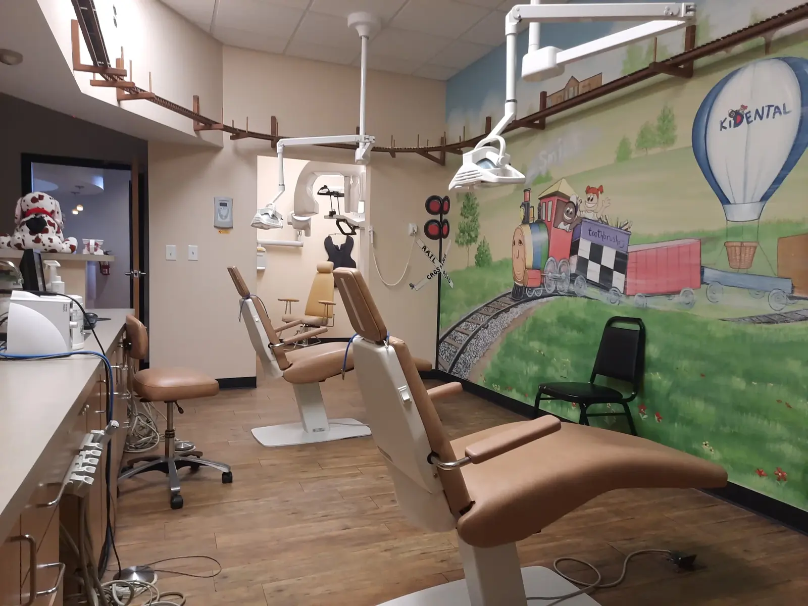 Children’s treatment area with a hot-air balloon mural