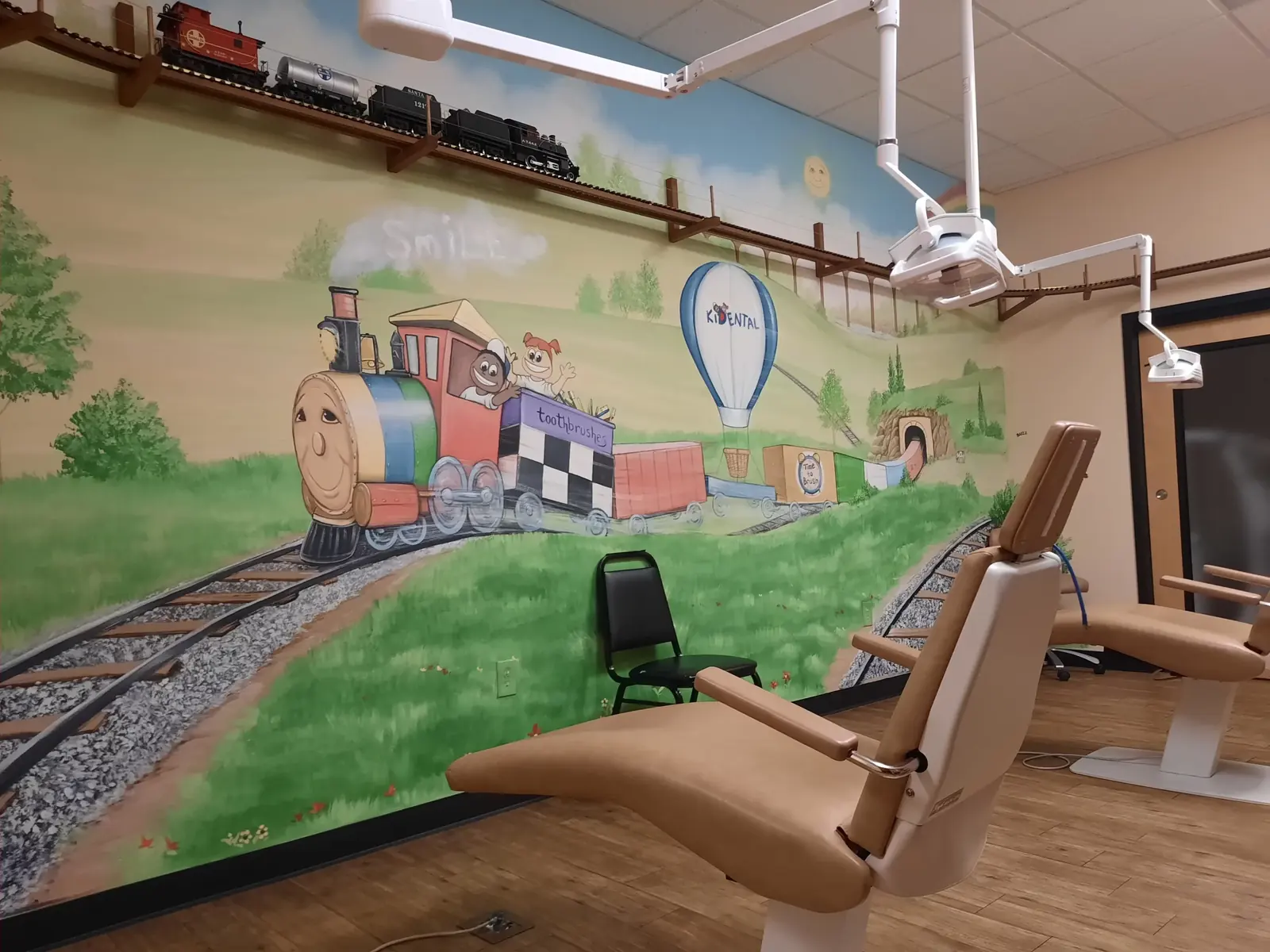 Treatment chair beside the train mural
