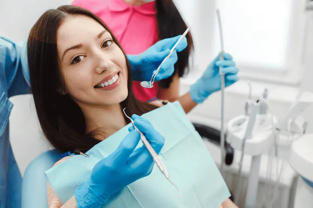 Patient smiling during a cosmetic dental treatment