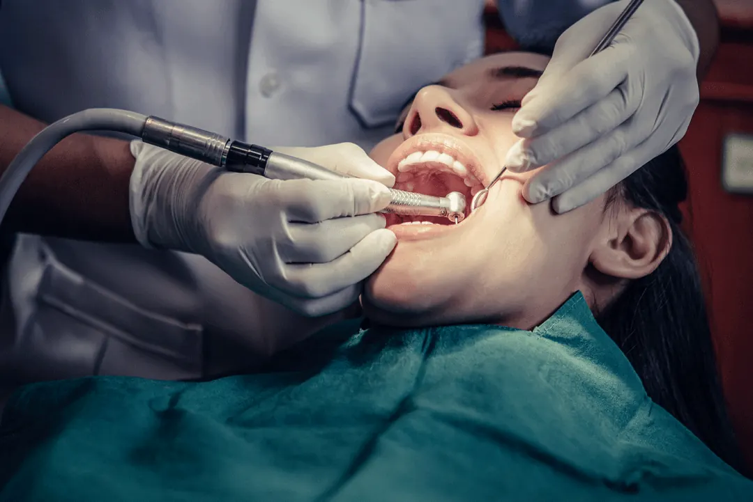 Dentist treating a patient’s gums